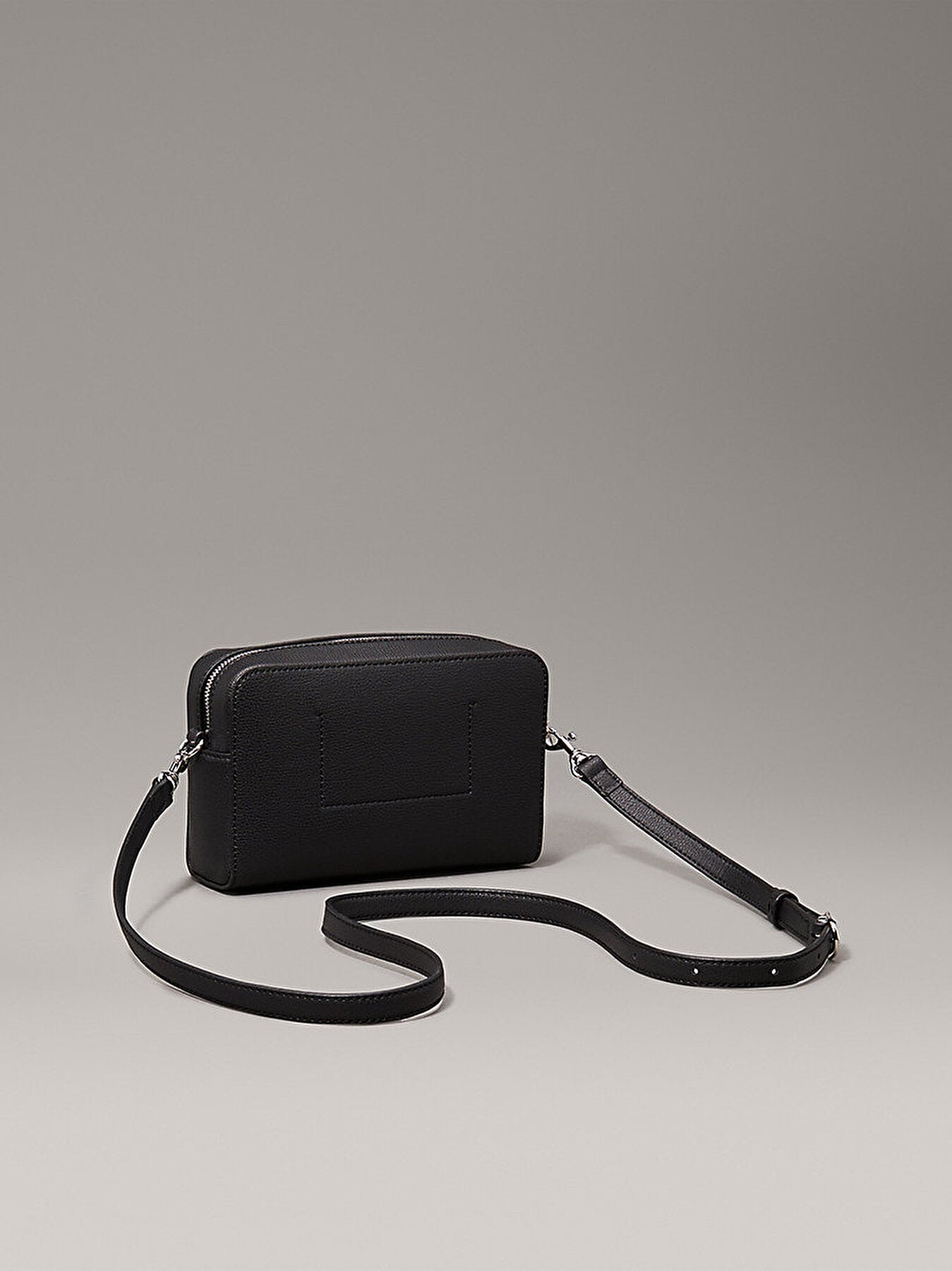 C.A.L.V.I.N  K.L.E.I.N Minimal Monogram Crossbody Bag